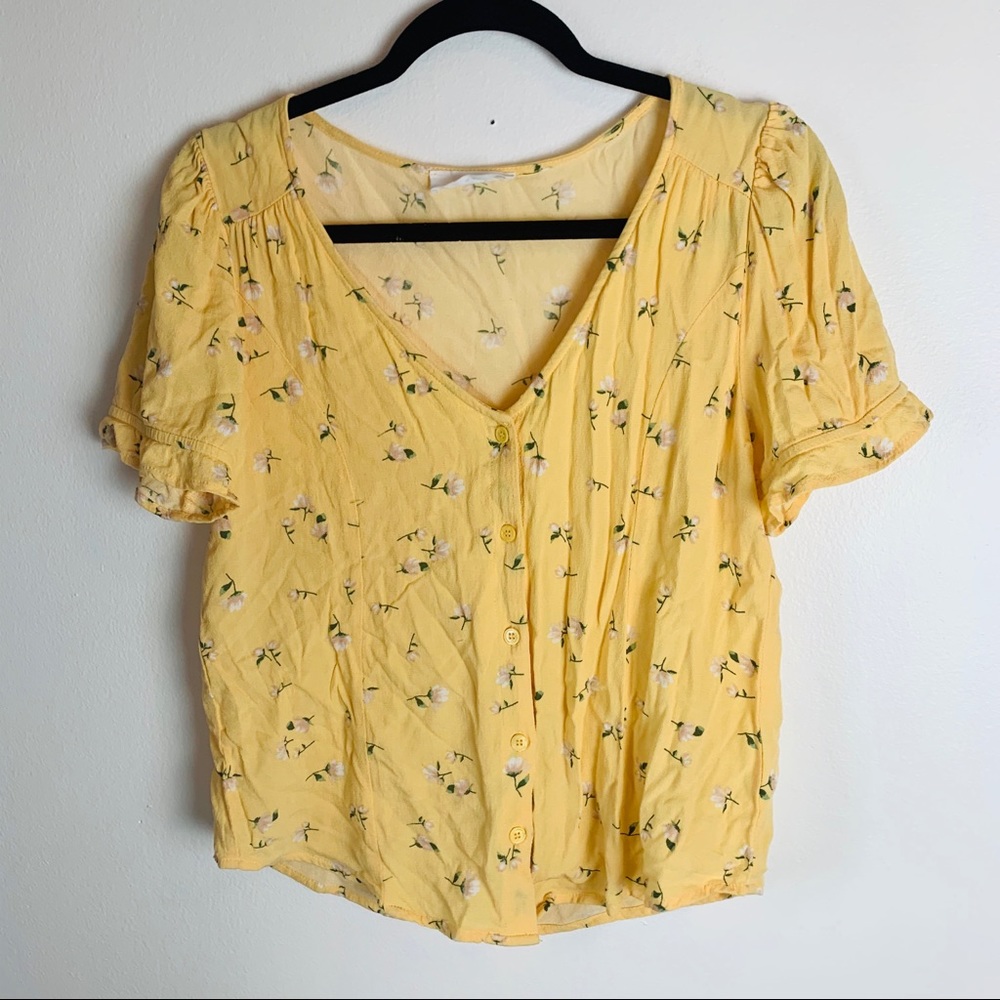 Elodie yellow flower print button up shirt.